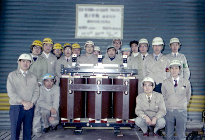 Commemorative photograph with the first molded transformer final product.
