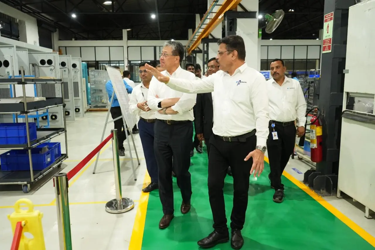 President and COO Shiro Kondo inspects a production line at Fuji Electric India Private Limited.